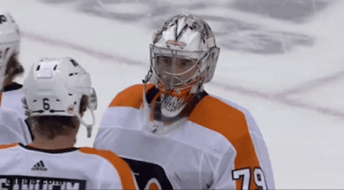 A Hockey Player Wearing The Number 79 Jersey GIF