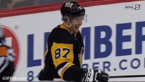 A Hockey Player Wearing The Number 87 Jersey GIF