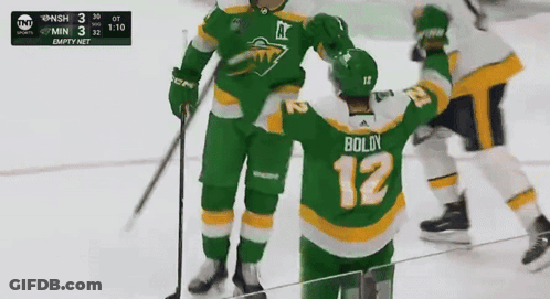 A Hockey Player With Boldy 12 On His Jersey GIF