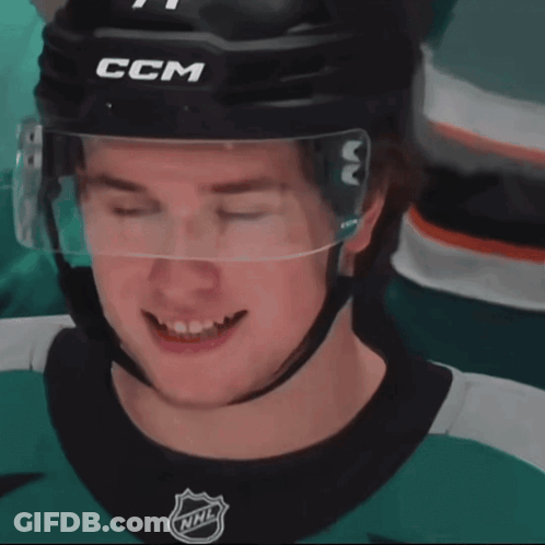 A Hockey Player With His Eyes Closed Wearing A Helmet That Says Ccm GIF