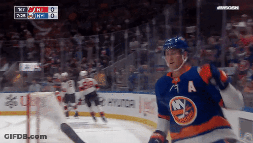 A Hockey Player With The Letter A On His Jersey Stands On The Ice GIF