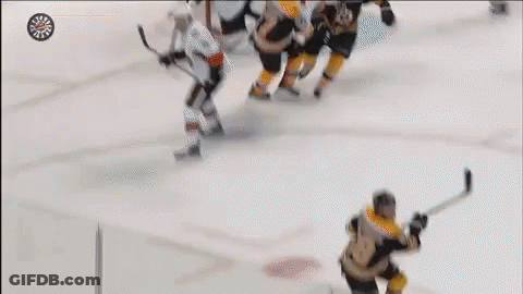 A Hockey Player With The Letter B On His Jersey Is Holding A Stick GIF