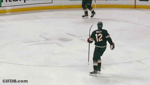 A Hockey Player With The Name Boldy On His Back GIF