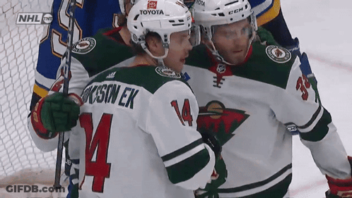 A Hockey Player With The Name Jackson Ek On His Jersey GIF