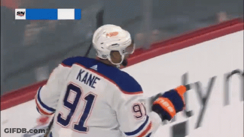 A Hockey Player With The Name Kane On His Back GIF