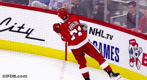 A Hockey Player With The Name Larkin On His Back GIF