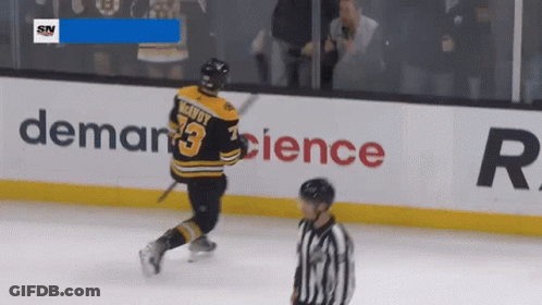 A Hockey Player With The Name Mcdouy On His Jersey GIF