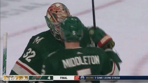 A Hockey Player With The Name Middleton On Their Back GIF