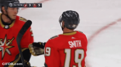 A Hockey Player With The Name Smith On His Back GIF