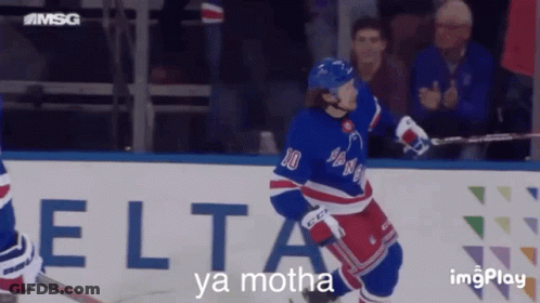A Hockey Player With The Number 10 On His Jersey Stands On The Ice GIF