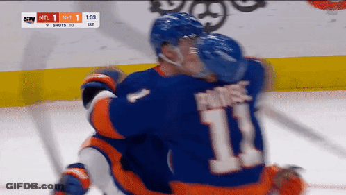 A Hockey Player With The Number 11 On His Back GIF