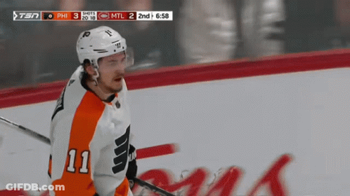 A Hockey Player With The Number 11 On His Jersey Is On The Ice GIF