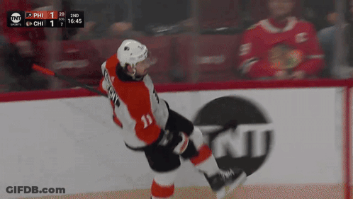 A Hockey Player With The Number 11 On His Jersey Is Skating On The Ice GIF