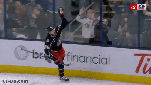 A Hockey Player With The Number 11 On His Jersey GIF