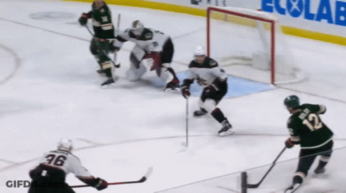 A Hockey Player With The Number 12 On His Back GIF