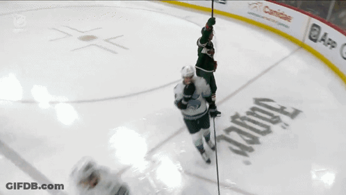 A Hockey Player With The Number 12 On His Back GIF