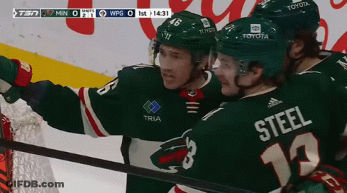 A Hockey Player With The Number 12 On His Jersey GIF