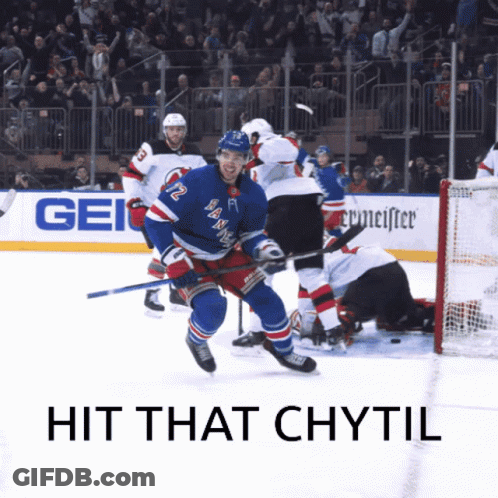 A Hockey Player With The Number 12 On His Jersey Is Skating On The Ice GIF