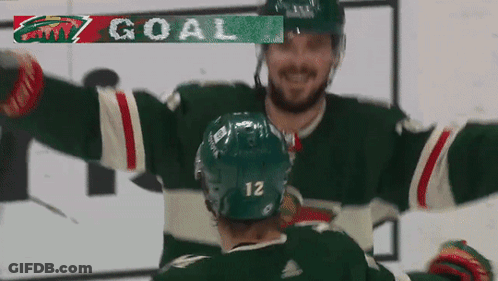 A Hockey Player With The Number 12 On His Jersey GIF
