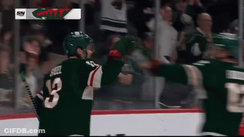 A Hockey Player With The Number 13 On Their Jersey GIF