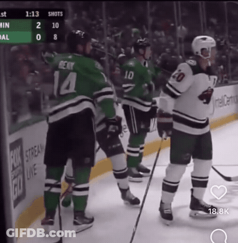 A Hockey Player With The Number 14 On His Jersey Stands On The Ice GIF