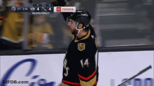 A Hockey Player With The Number 14 On His Shirt GIF
