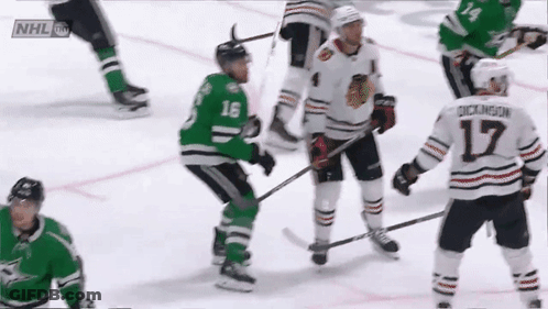 A Hockey Player With The Number 17 On His Jersey Stands On The Ice GIF