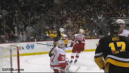 A Hockey Player With The Number 17 On His Jersey Stands On The Ice GIF