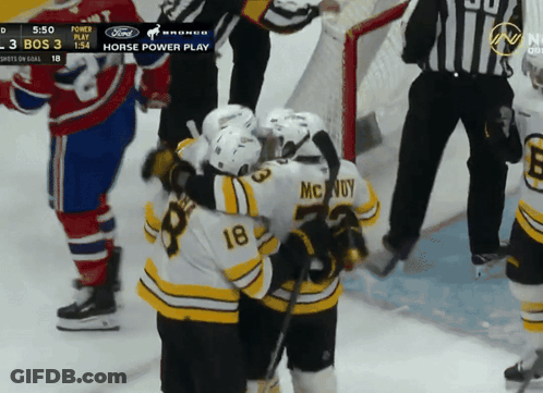A Hockey Player With The Number 18 On His Back GIF