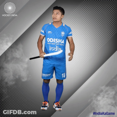 A Hockey Player With The Number 18 On His Shorts Is Holding A Stick GIF