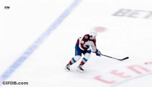 A Hockey Player With The Number 19 On His Back GIF