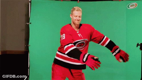 A Hockey Player With The Number 19 On His Shirt GIF