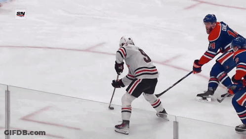 A Hockey Player With The Number 2 On His Jersey Is Playing On The Ice GIF