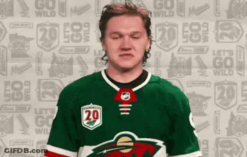 A Hockey Player With The Number 20 On His Shirt GIF