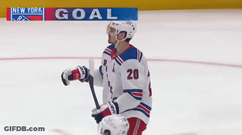 A Hockey Player With The Number 20 On Their Jersey GIF