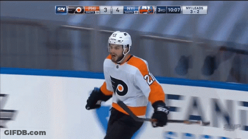 A Hockey Player With The Number 21 On His Jersey Is Holding A Hockey Stick GIF