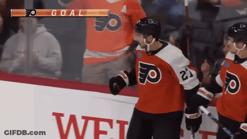 A Hockey Player With The Number 21 On His Jersey Stands On The Ice GIF