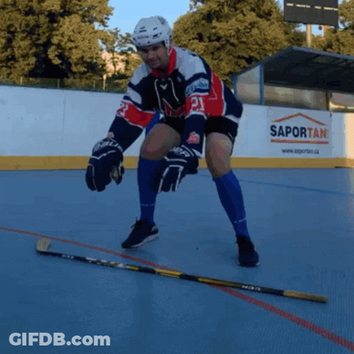 A Hockey Player With The Number 21 On His Jersey Stands On The Ice GIF