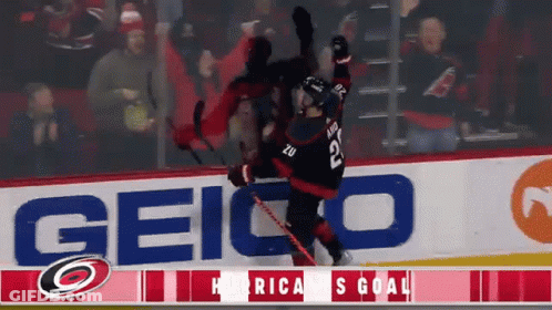 A Hockey Player With The Number 22 On His Jersey Is Falling GIF