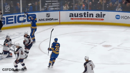 A Hockey Player With The Number 22 On Their Jersey GIF