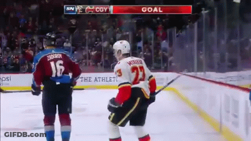 A Hockey Player With The Number 23 On His Back GIF