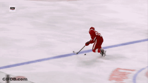 A Hockey Player With The Number 23 On His Jersey GIF