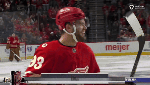 A Hockey Player With The Number 23 On His Jersey Smiles GIF
