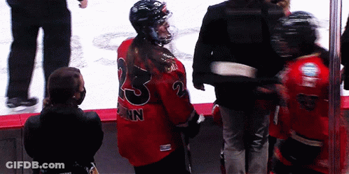 A Hockey Player With The Number 23 On The Back Of Their Jersey GIF