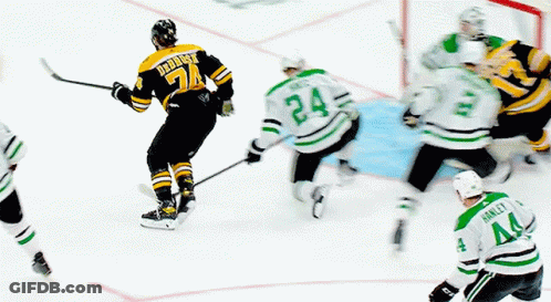 A Hockey Player With The Number 24 On His Jersey Is Skating On The Ice GIF