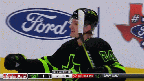 A Hockey Player With The Number 24 On His Jersey Stands In Front Of A Ford Logo GIF