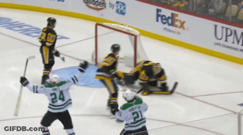 A Hockey Player With The Number 24 On His Jersey Stands On The Ice GIF