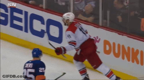 A Hockey Player With The Number 25 On His Jersey Stands On The Ice GIF