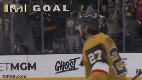 A Hockey Player With The Number 27 On His Jersey Stands On The Ice GIF