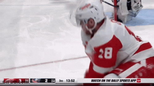 A Hockey Player With The Number 28 On His Jersey Is On The Ice GIF